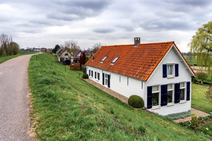 houses behind the river dikes near sleeuwijk (nl)